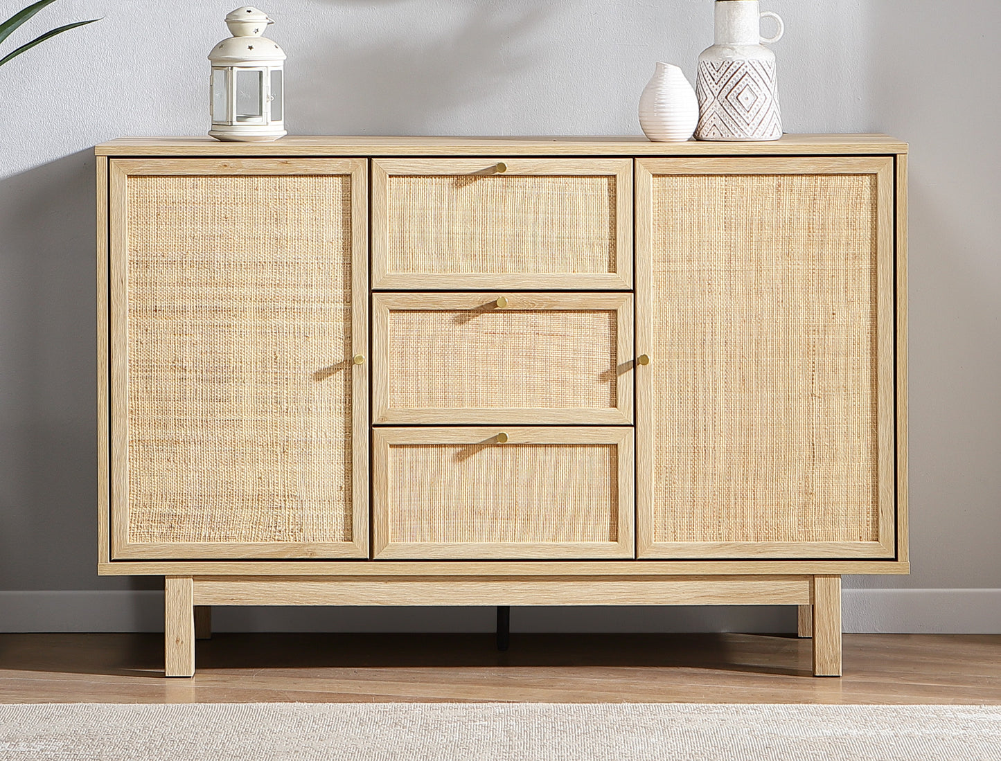 Wooden sideboard with rattan doors in a room setting