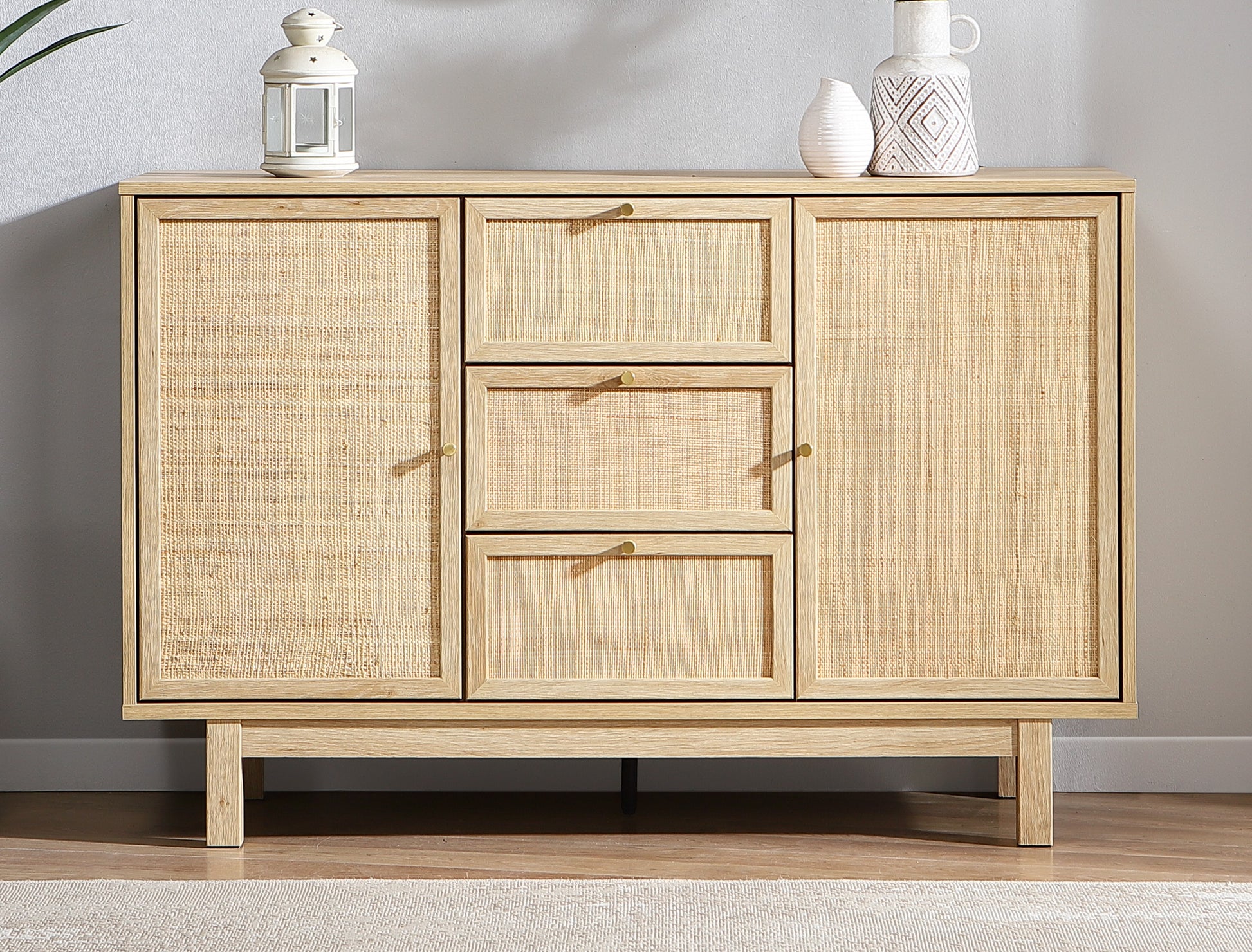 Wooden sideboard with rattan doors in a room setting
