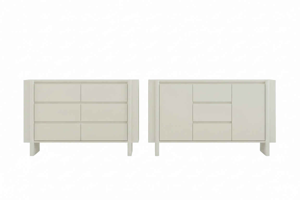Two white dressers in a room with a window and decor.