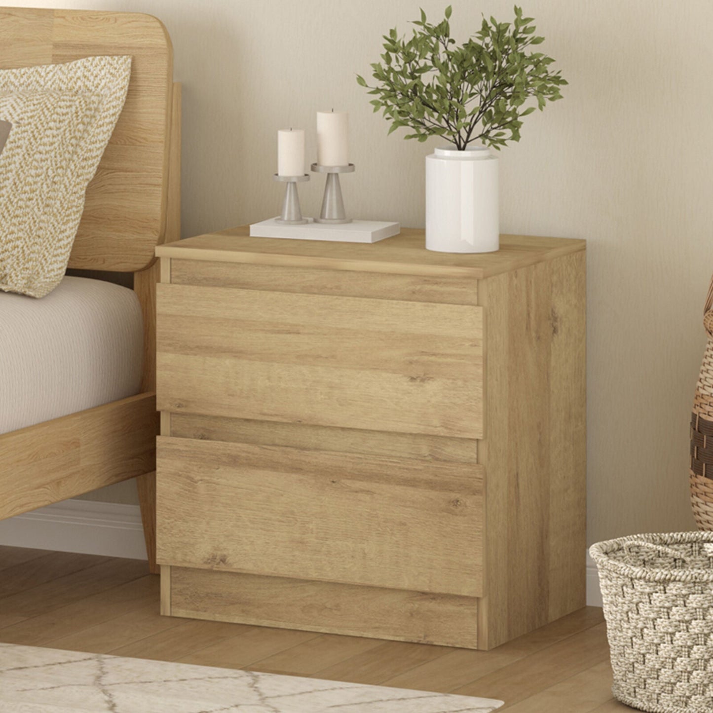 Light oak handleless bedside table with two drawers, modern minimalist design, fits various bedroom styles.