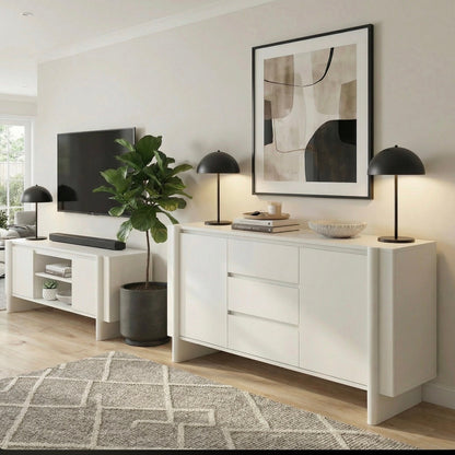 Modern living room with white sideboard, TV, and abstract art