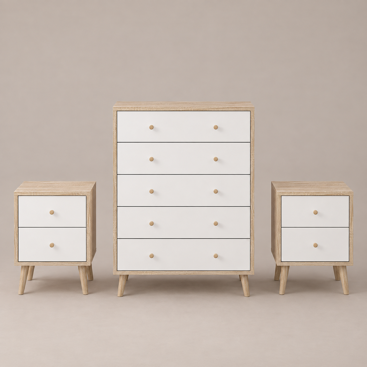 A three-piece bedroom furniture set including a five-drawer chest, a two-drawer nightstand, and a matching side table, all featuring white drawer fronts, light natural wood tops and legs, and round wooden knobs, set against a solid warm gray background.